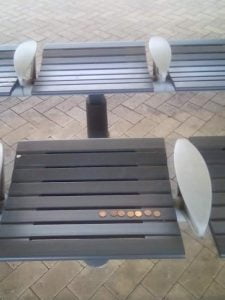 bench with coins