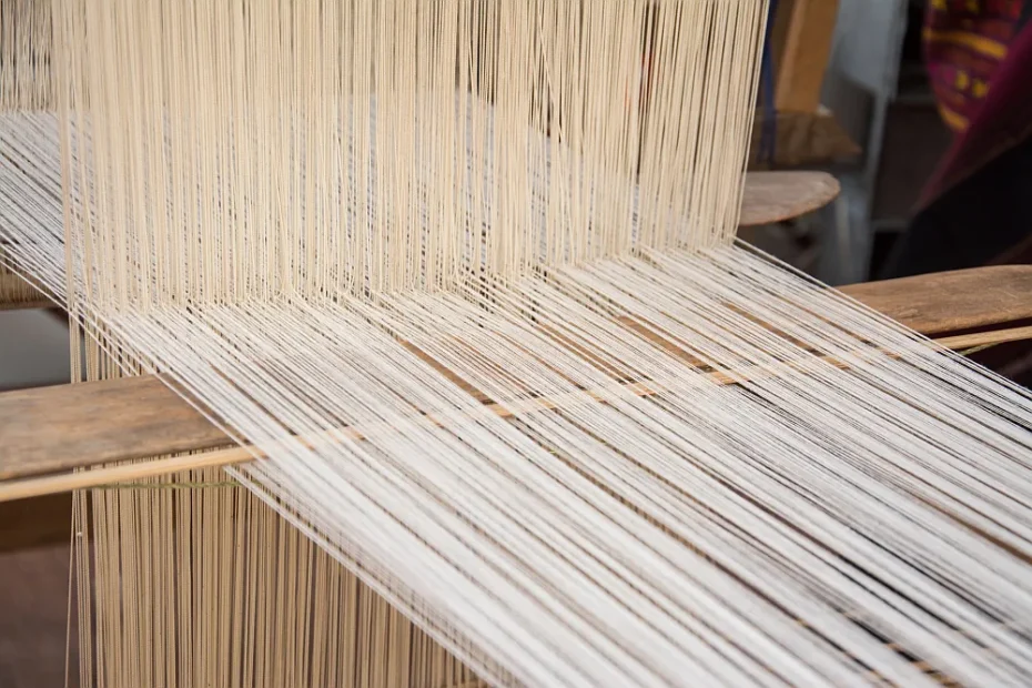 close-up of weaving silk on a traditional loom